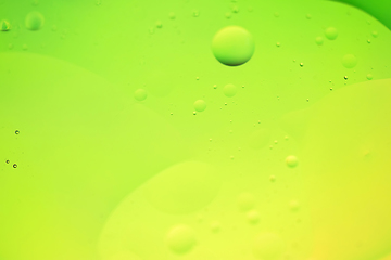 Image showing Green and yellow abstract background picture made with oil, water and soap