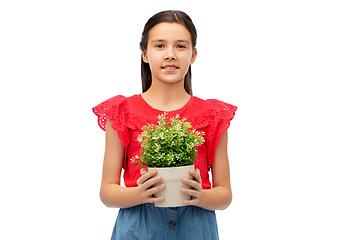 Image showing happy smiling girl holding flower in pot