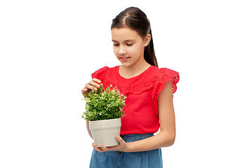 Image showing happy smiling girl holding flower in pot