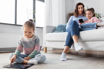 Image showing happy girl with tablet pc and family at home