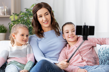 Image showing happy family taking selfie by smartphone at home