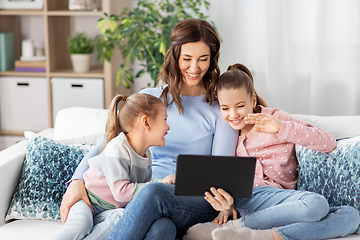 Image showing mother and children having video call on tablet pc