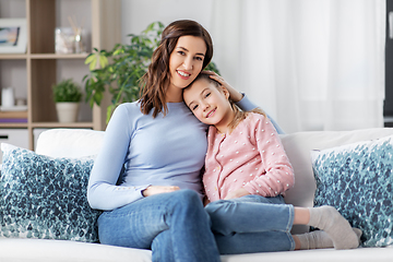 Image showing happy smiling mother with daughter at home