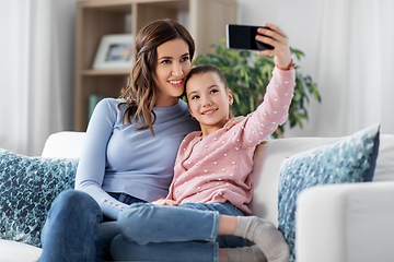 Image showing happy family taking selfie by smartphone at home