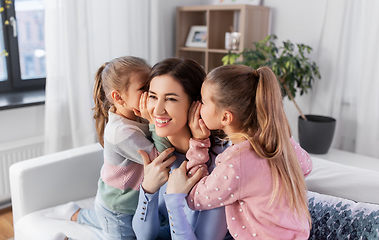 Image showing happy mother and daughters gossiping at home