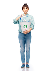 Image showing smiling young woman sorting plastic waste