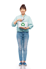 Image showing smiling young asian woman sorting metallic waste