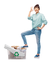 Image showing happy smiling asian woman sorting paper waste