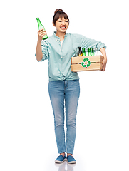 Image showing smiling young asian woman sorting glass waste