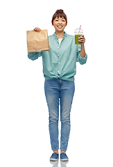 Image showing happy asian woman with drink and food in paper bag