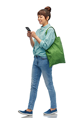 Image showing woman with phone and reusable food shopping bag