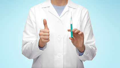 Image showing close up of doctor with syringe showing thumbs up