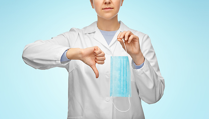 Image showing female doctor with mask showing thumbs down