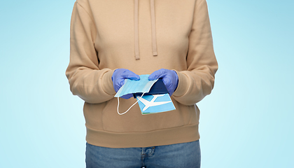 Image showing woman with mask, passport and air ticket