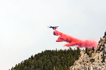 Image showing firefighting aircraft dumping retardant