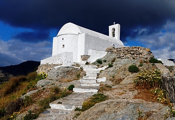 Image showing Dramatic view of Christian Orthodox church of Agios Konstantinos in the town of Chora in Serifos island, Greece under cloudy sky