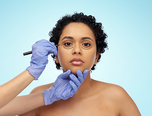 Image showing face of african woman and hands with marker