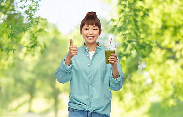 Image showing happy smiling asian woman with can drink