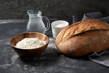 Image showing bread, wheat flour, salt and water in glass jug