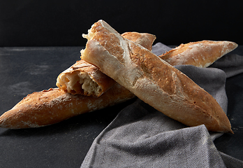 Image showing close up of baguette bread on kitchen towel