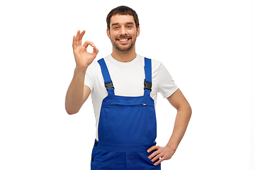 Image showing happy smiling male worker or builder showing ok