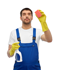 Image showing male cleaner cleaning with sponge and detergent