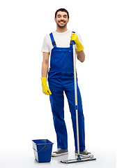 Image showing male cleaner cleaning floor with mop and bucket