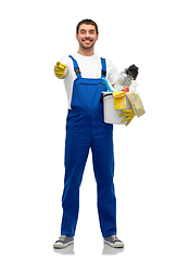 Image showing male cleaner in overall with cleaning supplies