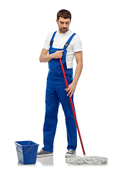 Image showing male cleaner cleaning floor with mop and bucket