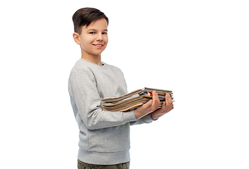 Image showing smiling boy with magazines sorting paper waste