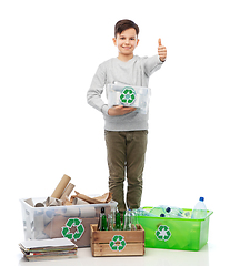Image showing smiling boy sorting paper, metal and plastic waste
