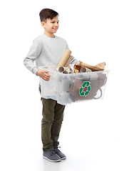 Image showing smiling boy sorting paper waste