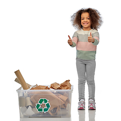 Image showing smiling african american girl sorting paper waste