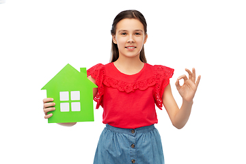 Image showing happy little girl with green house icon showing ok