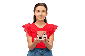Image showing smiling girl holding house model