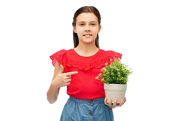 Image showing happy smiling girl holding flower in pot