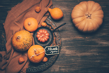 Image showing Happy Thanksgiving Day background, wooden table decorated with Pumpkins and Candles