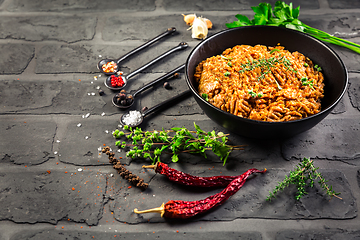 Image showing Mince. Marinated Ground meat with ingredients for cooking on black background