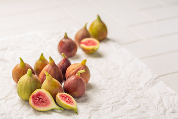 Image showing Tasty organic figs on white background