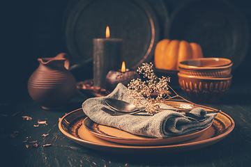 Image showing Restaurant autumn table setting. Thanksgiving holiday Place setting autumn decoration.