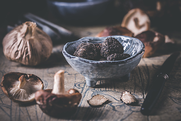 Image showing Truffles and shiitake mushrooms and spices on kitchen table