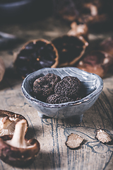 Image showing Truffles and shiitake mushrooms and spices on kitchen table