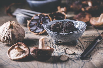 Image showing Truffles and shiitake mushrooms and spices on kitchen table