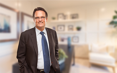 Image showing Handsome Businessman In Suit and Tie Standing in His Office