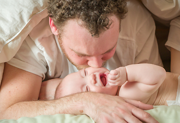 Image showing Mixed Race Chinese and Caucasian Baby Boy Laying In Bed with His