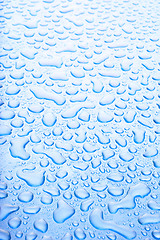 Image showing water droplets blue background