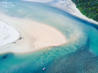 Image showing A fisherman waiting for a catch on the inlet