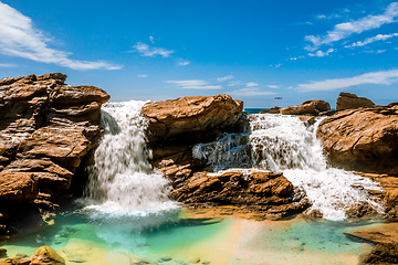 Image showing Waterfall into ocean rock pool