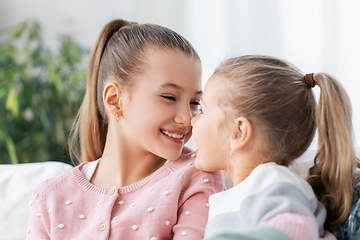 Image showing two happy smiling little girls or sisters at home