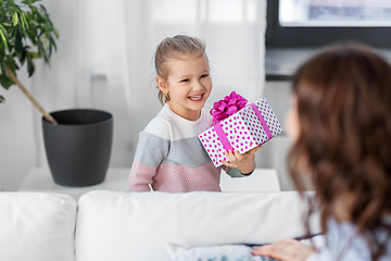 Image showing happy daughter giving present to mother at home